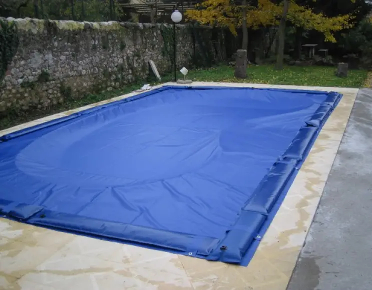 Telo copertura piscina combinato in pvc 400 gr/mq con predisposizione sacche d'acqua e occhielli